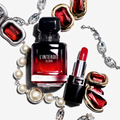 Givenchy L'Interdit Elixir fragrance bottle with red gemstones, pearls and lipstick
