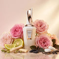 Spirito Mystic by French Avenue Extrait de Parfum white bottle with rose gold cap surrounded by pink roses, lemon and vanilla